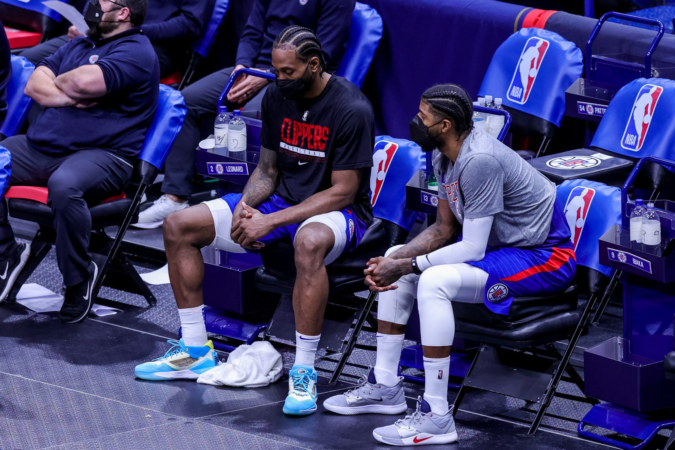 Mar 14, 2021; New Orleans, Louisiana, USA;  LA Clippers guard Paul George (13) and forward Kawhi Leonard (2) react to a play from the bench against New Orleans Pelicans during the second half at the Smoothie King Center. Mandatory Credit: Stephen Lew-USA TODAY Sports